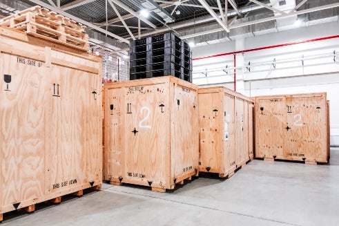 Custom crating kept in the airport warehouse for shipping in Georgia