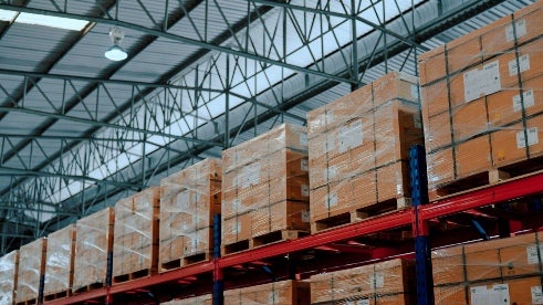 Custom packaging pallets stored in a warehouse for shipping in Georgia.